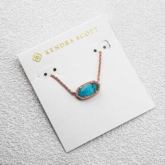 Kendra Scott Elisa Gold Pendant Necklace in Cat Kendra Scott Sky Blue Cat��s Eye Necklace